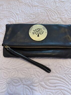 Mulberry Black Leather Wristlet Clutch with Gold Tree Medallion. As is.